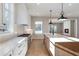 Elegant kitchen with stainless steel appliances and bright open plan living at 145 Cedarwood Ln, Roswell, GA 30075