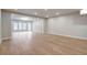 Open living area featuring hardwood flooring and a well-lit space from many windows and recessed lighting at 145 Cedarwood Ln, Roswell, GA 30075
