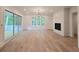 Spacious living room with a fireplace, lots of natural light, and access to the deck at 145 Cedarwood Ln, Roswell, GA 30075