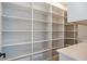 Walk-in pantry with extensive shelving, ample storage and countertop at 145 Cedarwood Ln, Roswell, GA 30075