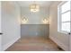 Cozy room with light walls, hardwood floors, and modern lighting fixtures at 145 Cedarwood Ln, Roswell, GA 30075