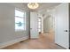 Bright room with hardwood floors, white trim, and a view of the outdoors at 145 Cedarwood Ln, Roswell, GA 30075