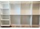 Large walk-in closet featuring custom shelving and hanging space at 145 Cedarwood Ln, Roswell, GA 30075
