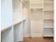 Spacious walk-in closet with custom shelving, hanging racks, and ample storage at 145 Cedarwood Ln, Roswell, GA 30075