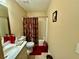 Full bathroom with shower-tub combo and tiled floors at 25 Horseshoe Ct, Covington, GA 30014