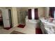 Bathroom with a tiled floor, walk-in shower, and a relaxing soaking tub at 25 Horseshoe Ct, Covington, GA 30014