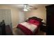 Bedroom features a bed with a decorative spread, bedside lamps, and an open closet at 25 Horseshoe Ct, Covington, GA 30014