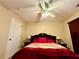 Bedroom features a bed with a decorative spread, bedside lamps, and an open closet at 25 Horseshoe Ct, Covington, GA 30014