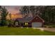 Charming brick home with well-manicured lawn and inviting curb appeal at sunset at 25 Horseshoe Ct, Covington, GA 30014