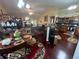 Open-concept kitchen with stainless steel appliances and adjacent living area at 25 Horseshoe Ct, Covington, GA 30014
