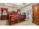 Elegant main bedroom with tray ceilings, ensuite bathroom and ample closet space at 25 Horseshoe Ct, Covington, GA 30014