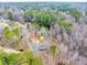 Aerial view of the house surrounded by lush mature trees at 1980 Two Springs Way, Lawrenceville, GA 30043
