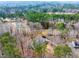 An aerial view of the home, large lot, and lush mature trees at 1980 Two Springs Way, Lawrenceville, GA 30043