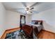 Bedroom with hardwood floors, ceiling fan, and natural light coming through the window at 1980 Two Springs Way, Lawrenceville, GA 30043