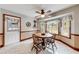 Charming breakfast nook features tile floor, wood table, and natural light from multiple windows at 1980 Two Springs Way, Lawrenceville, GA 30043