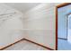 Spacious walk-in closet featuring white wire shelving and bright, neutral-colored flooring at 1980 Two Springs Way, Lawrenceville, GA 30043