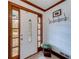 The front foyer with a decorative glass front door, coat rack, and tile flooring at 1980 Two Springs Way, Lawrenceville, GA 30043