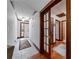 Inviting hallway featuring tile flooring and beautiful wood trim throughout, leading to the foyer at 1980 Two Springs Way, Lawrenceville, GA 30043