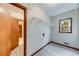 This laundry room offers wire shelving, natural light, and connections for laundry machines at 1980 Two Springs Way, Lawrenceville, GA 30043