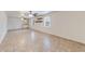 Spacious living room featuring tile flooring, neutral walls, two ceiling fans, and natural lighting from two windows at 1980 Two Springs Way, Lawrenceville, GA 30043