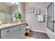 The clean bathroom features a vanity with a stone countertop and a glass-enclosed shower at 2139 Hickory Se Bnd # E, Conyers, GA 30013