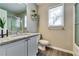 Well-lit bathroom featuring vanity with granite countertop and glass enclosed shower at 2139 Hickory Se Bnd # E, Conyers, GA 30013