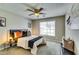 Stylish bedroom with a modern bed, ceiling fan, and natural light from a window at 2139 Hickory Se Bnd # E, Conyers, GA 30013