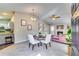Open-concept living space featuring an adjacent kitchen, fireplace, and dining area at 2139 Hickory Se Bnd # E, Conyers, GA 30013