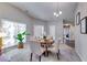 Bright dining area featuring a plant and lots of natural light from the window at 2139 Hickory Se Bnd # E, Conyers, GA 30013