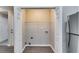 A clean and ready laundry closet with washer and dryer hookups with storage shelf at 2139 Hickory Se Bnd # E, Conyers, GA 30013