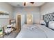 Spacious main bedroom boasts a comfortable bed, a closet, and neutral decor at 2139 Hickory Se Bnd # E, Conyers, GA 30013