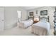 Cozy bedroom featuring two beds, soft carpet, natural light, and neutral tones to create a serene retreat at 2964 Perimeter Cir, Buford, GA 30519