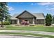 Community clubhouse with stone accents, manicured lawn, and ornamental trees, creating an inviting space at 2964 Perimeter Cir, Buford, GA 30519