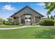 Community center entrance with stone pillars and manicured landscaping. Serene outdoor space for residents at 2964 Perimeter Cir, Buford, GA 30519