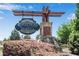Elegant 'Reflections of Braselton' community sign surrounded by lush landscaping and blooming bushes at 2964 Perimeter Cir, Buford, GA 30519