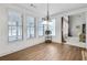 Bright dining area with hardwood floors and views into the living room at 2964 Perimeter Cir, Buford, GA 30519