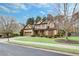 Charming two-story home with manicured landscaping, a two-car garage, and a lush green front lawn at 2964 Perimeter Cir, Buford, GA 30519