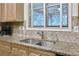 Close-up of the kitchen sink with stainless steel appliances and granite countertop at 2964 Perimeter Cir, Buford, GA 30519