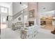 Bright living room features a stone fireplace, high ceilings, and staircase access at 2964 Perimeter Cir, Buford, GA 30519