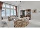 Vaulted living room is filled with natural light and features a stone fireplace at 2964 Perimeter Cir, Buford, GA 30519