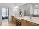 The main bathroom offers dual sinks, vanity seating and large mirrors at 2964 Perimeter Cir, Buford, GA 30519