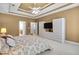 The main bedroom features a tray ceiling and custom cabinet with storage at 2964 Perimeter Cir, Buford, GA 30519