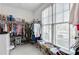Spacious walk-in closet with custom shelving and storage solutions and natural light from a large window at 2964 Perimeter Cir, Buford, GA 30519