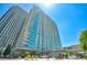 Modern high-rise building with sleek glass facade and contemporary architectural details, reflecting the vibrant city skyline at 361 17Th St # 2122, Atlanta, GA 30363