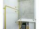 A modern closet featuring golden pipe supports and a concrete accent wall at 361 17Th St # 2122, Atlanta, GA 30363