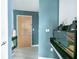 Modern condo entryway with stylish decor, featuring a sleek console table, updated light fixtures, and neutral paint at 361 17Th St # 2122, Atlanta, GA 30363