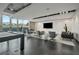 Modern game room featuring a pool table, lounge seating, large windows, and stylish decor, perfect for relaxation and entertainment at 361 17Th St # 2122, Atlanta, GA 30363