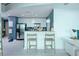 Modern kitchen featuring stainless steel appliances, stylish bar stool seating, and attractive pendant lighting at 361 17Th St # 2122, Atlanta, GA 30363