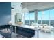 Well-lit kitchen with granite countertops, sleek black backsplash, stainless steel appliances, and an open-concept design at 361 17Th St # 2122, Atlanta, GA 30363