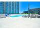 Rooftop pool area features comfortable lounge chairs, and clear views of the city skyline for relaxation and enjoyment at 361 17Th St # 2122, Atlanta, GA 30363